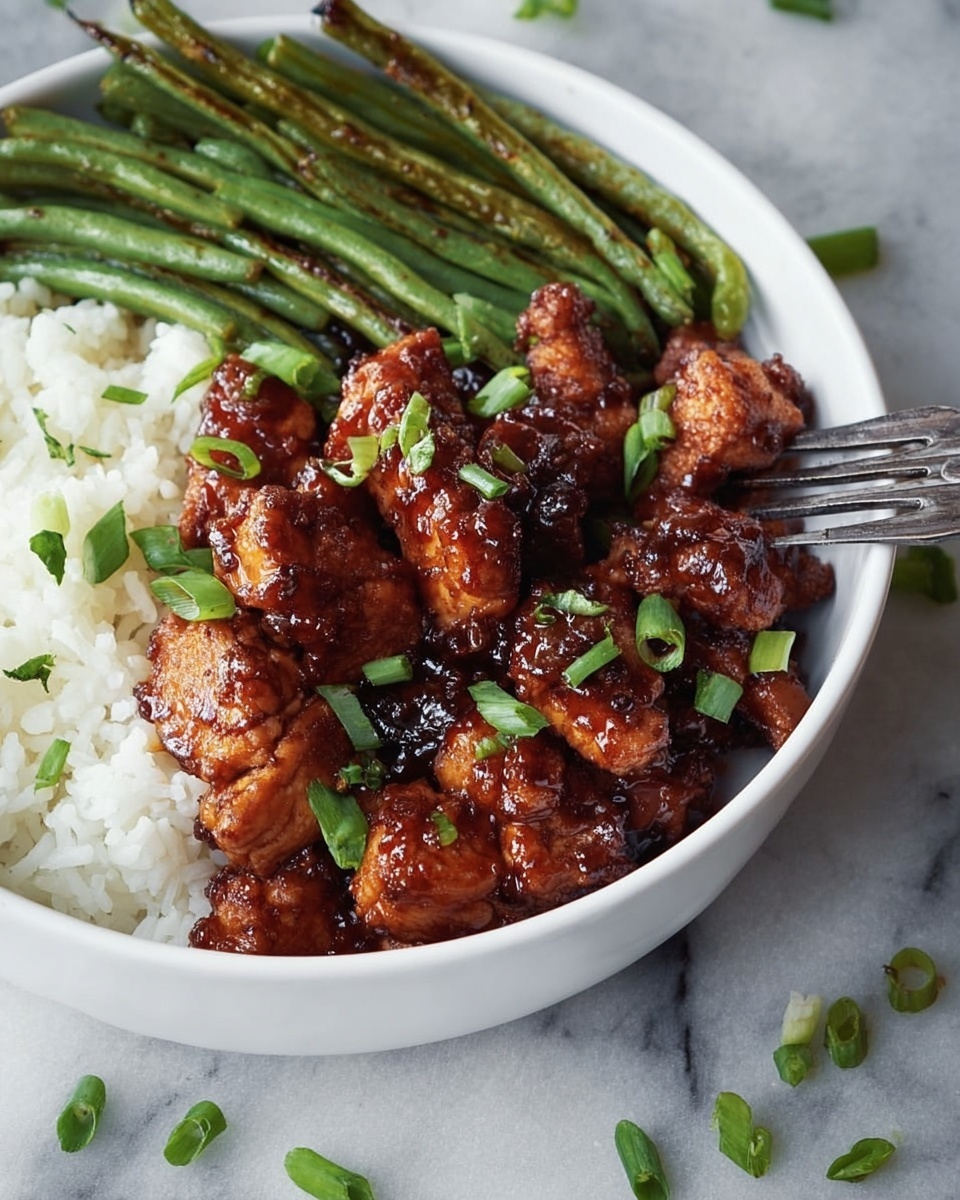 A white bowl contains a meal with three layers: the first layer is white rice on the left side, the second layer is green beans with a slightly charred texture placed behind the main dish, and the third layer is dark brown glazed chicken pieces covered in a shiny sauce sprinkled with chopped green onions, taking up the front and center of the bowl. A metal fork rests on the right edge of the bowl. The bowl is set on a white marbled surface with scattered small green onion pieces around it. Photo taken with an iphone --ar 4:5 --v 7