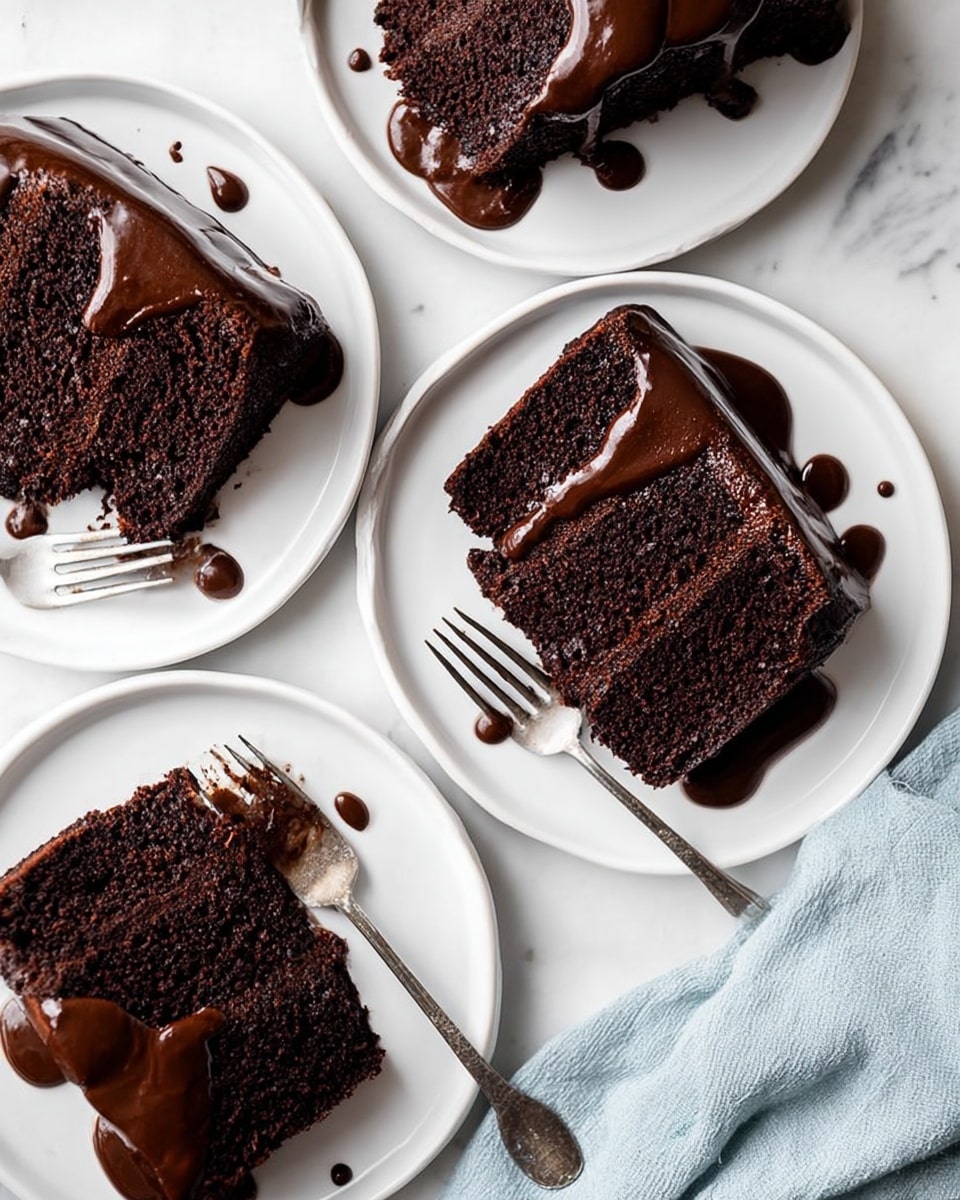 The image shows multiple slices of dark chocolate cake arranged on white round plates, each slice with one thick, moist layer covered at the top with smooth, glossy chocolate sauce that drips slightly over the edges. The cake texture appears dense and rich, and the sauce varies in thickness, pooling slightly on the plates. There are silver forks placed near some plates, and a light blue cloth is visible at the bottom right corner over a white marbled surface. The scene is bright with natural light, showing the contrast between the dark cake and the clean white plates. Photo taken with an iphone --ar 4:5 --v 7