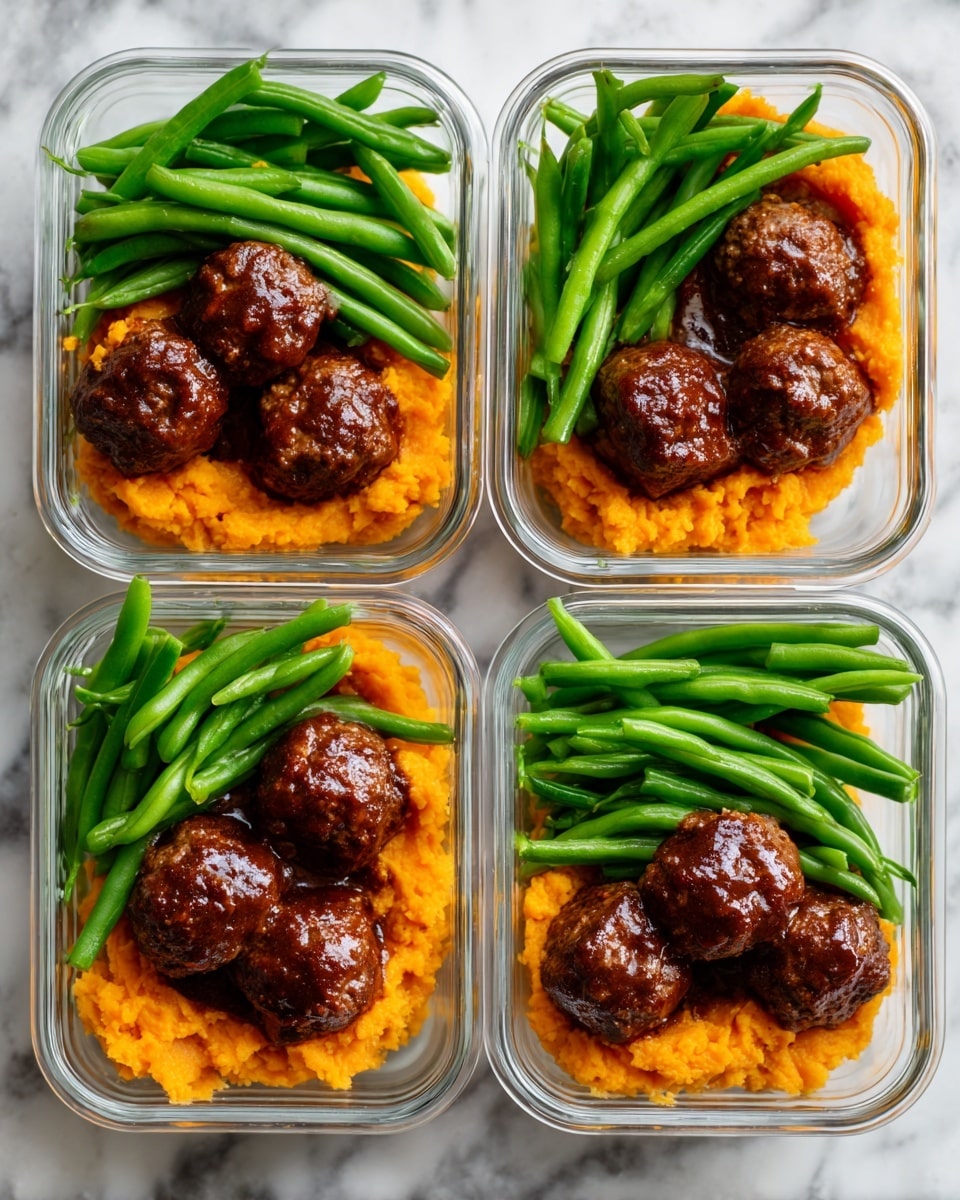 Four clear glass containers are arranged in a 2x2 grid on a white marbled surface. Each container holds three dark brown glazed meatballs placed on top of bright orange mashed sweet potatoes that cover about half the bottom layer. Next to the meatballs and sweet potatoes, there is a neat pile of fresh, vibrant green beans filling the remaining half of each container. The textures of the mashed sweet potatoes are smooth and fluffy with slight ridges, while the green beans look crisp, and the meatballs have a shiny, slightly sticky glaze. photo taken with an iphone --ar 4:5 --v 7